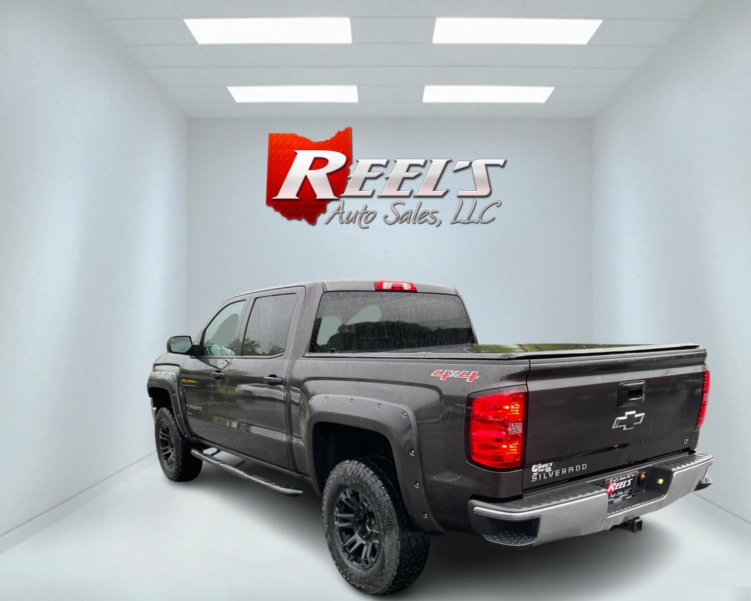 2014 Gray /Black Chevrolet Silverado 1500 LT Crew Cab 4WD (3GCUKREC7EG) with an 5.3L V8 OHV 16V engine, 6-Speed Automatic transmission, located at 11115 Chardon Rd. , Chardon, OH, 44024, (440) 214-9705, 41.580246, -81.241943 - This 2014 Chevrolet Silverado 1500 LT Crew Cab is a capable and well-equipped pickup truck. It's powered by a 5.3L Vortec V8 engine mated to a 6-speed automatic transmission with 3.42 gearing, delivering a robust 9,100-pound towing capacity. This particular model is lifted and rides on 33-inch all-t - Photo #7